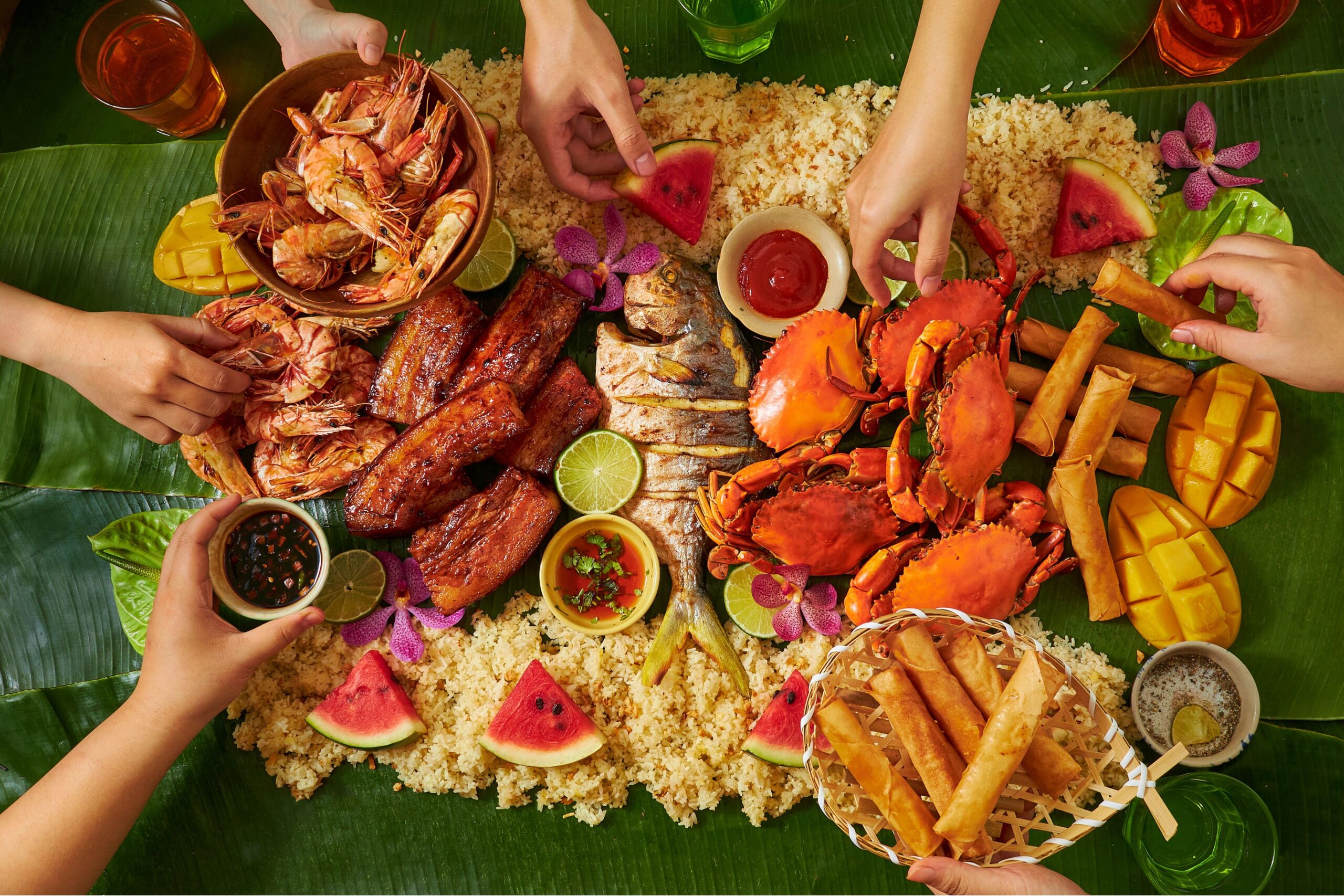 Filipino family enjoying Christmas dinner Noche Buena feast with traditional dishes and celebration