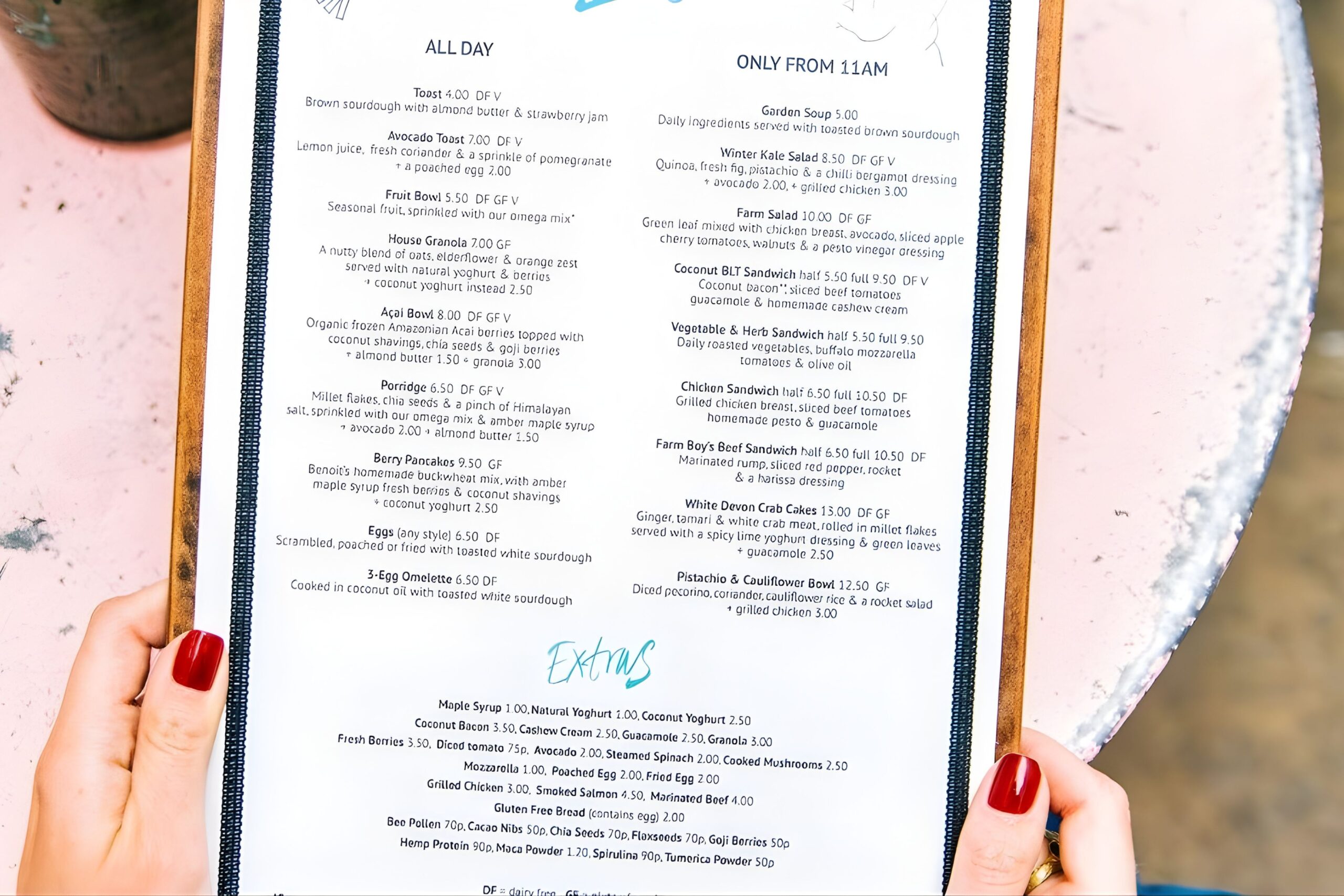 lady holds menu card in restaurant