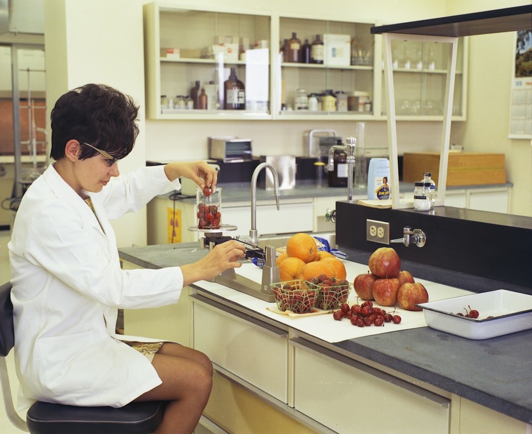 A food scientist examines natural ingredients in a laboratory, reflecting the spirit of food innovation at IFT FIRST
