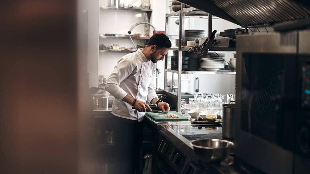 A chef monitors a tray of tomatoes and mushrooms, using key techniques to build deep flavour in a meatless dish.