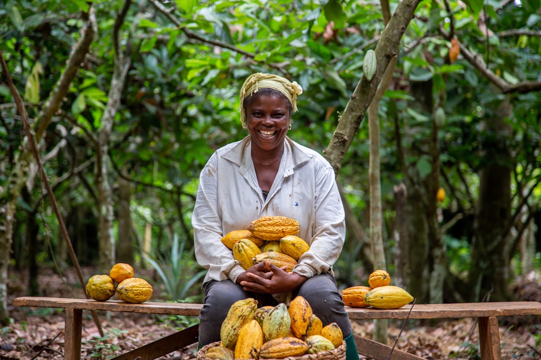 laughing woman cocoa farmer in the forest