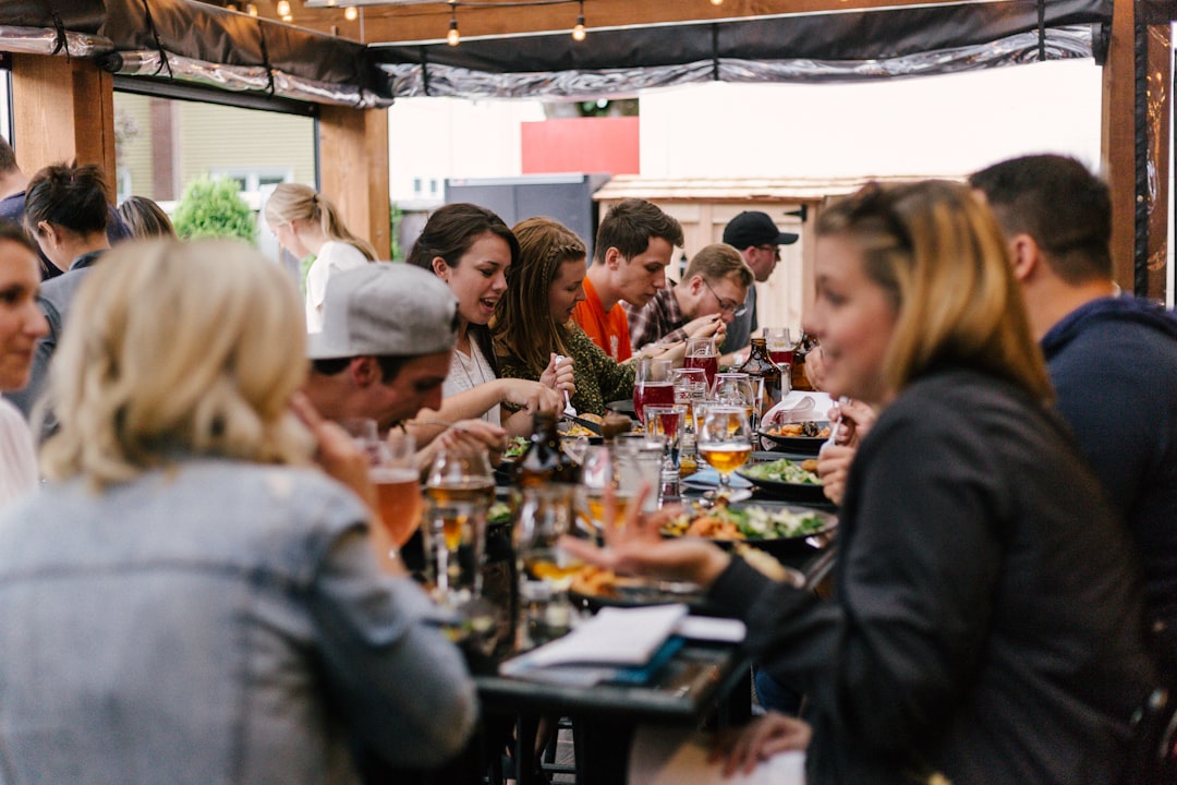 A chef carefully plates a dish for festival visitors, capturing the craft at the heart of British food culture in Edinburgh
