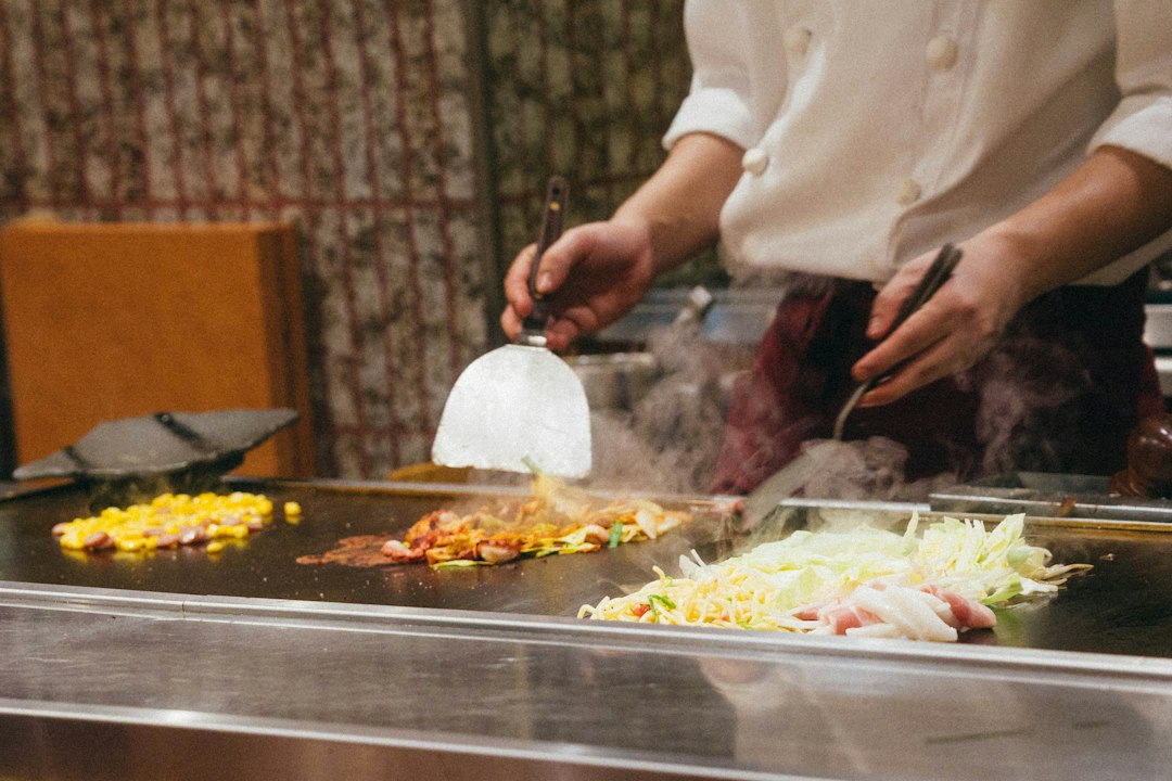 A chef roasting seasonal root vegetables in a professional kitchen at the autumn equinox, demonstrating classic techniques