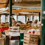 An indigenous producer displays heritage vegetables at a market stall, representing the spirit of Terra Madre.