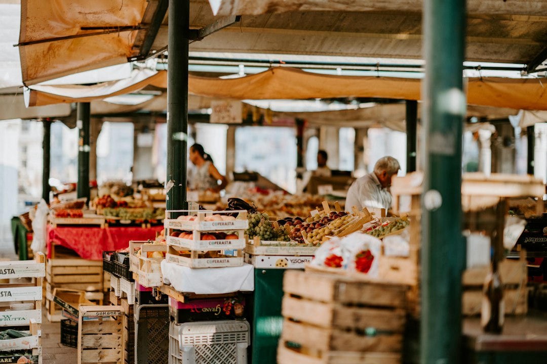An indigenous producer displays heritage vegetables at a market stall, representing the spirit of Terra Madre.