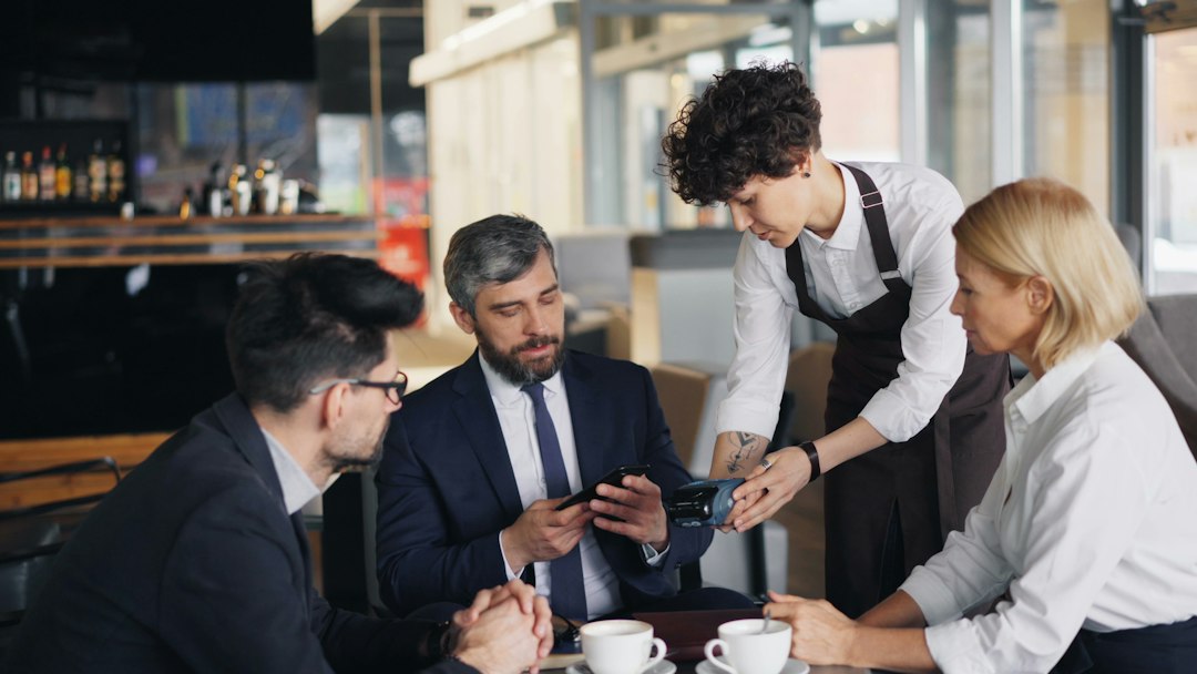 Restaurant manager briefing staff on new tipping rules